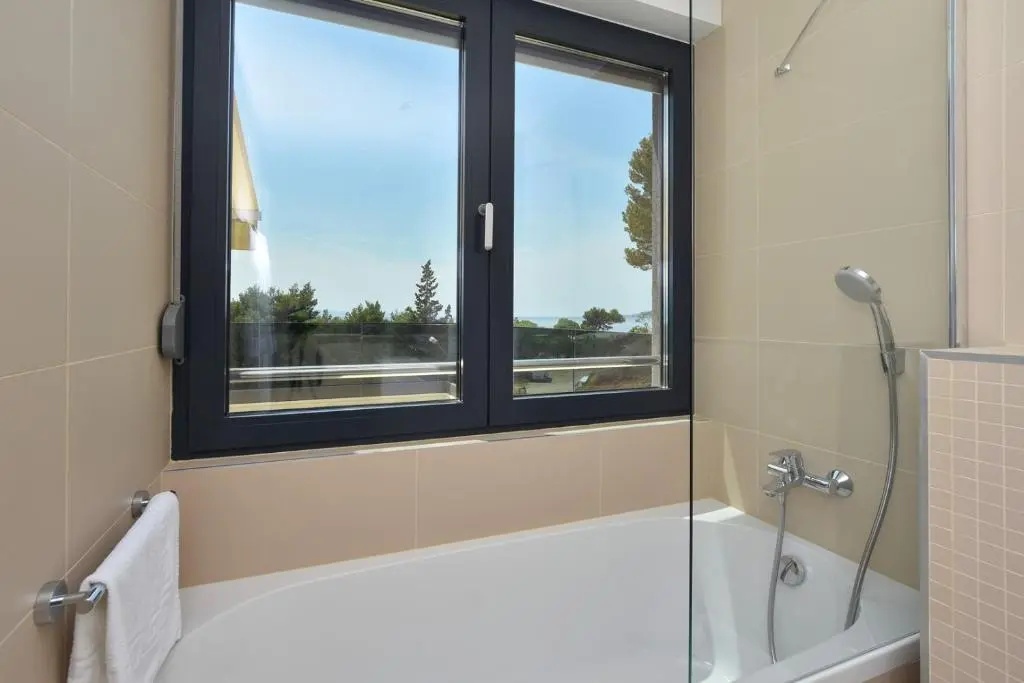 Luxury, seafront Villa Petra with heated pool only 50m from beach