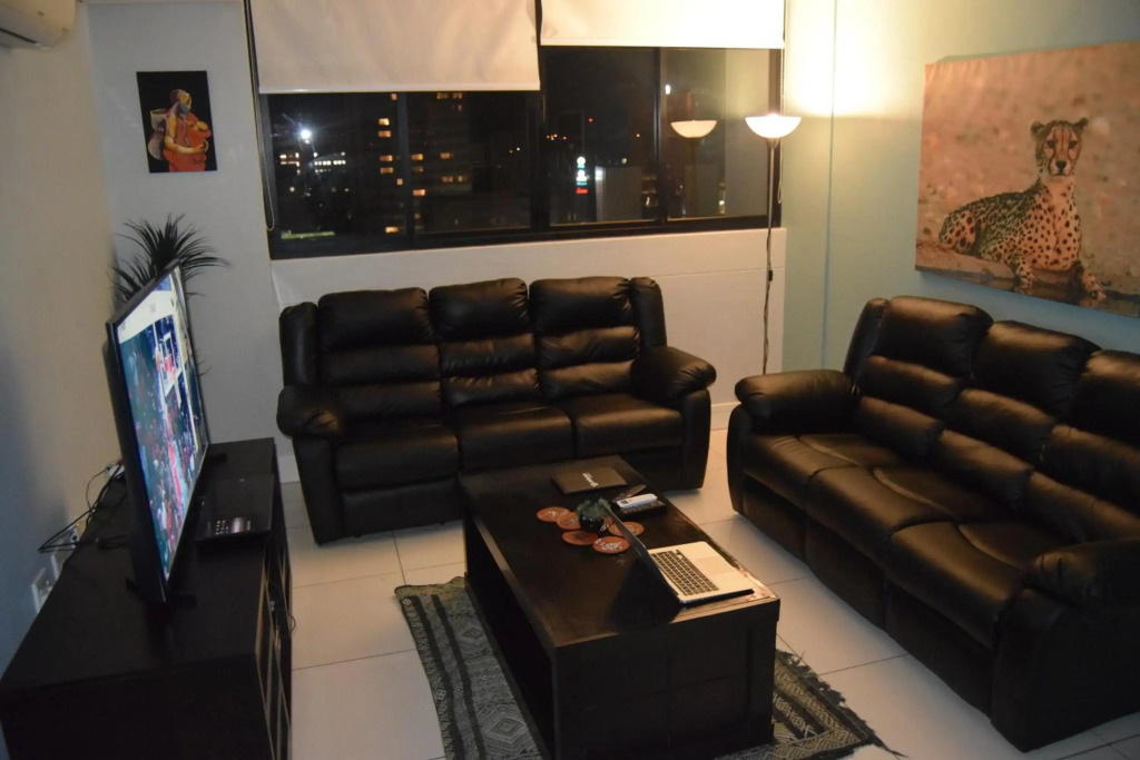 Highrise Windhoek apartment with skyline view, pool and gym