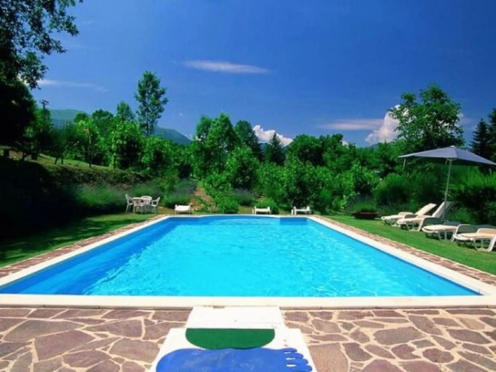 A holiday home with swimming pool in a national park