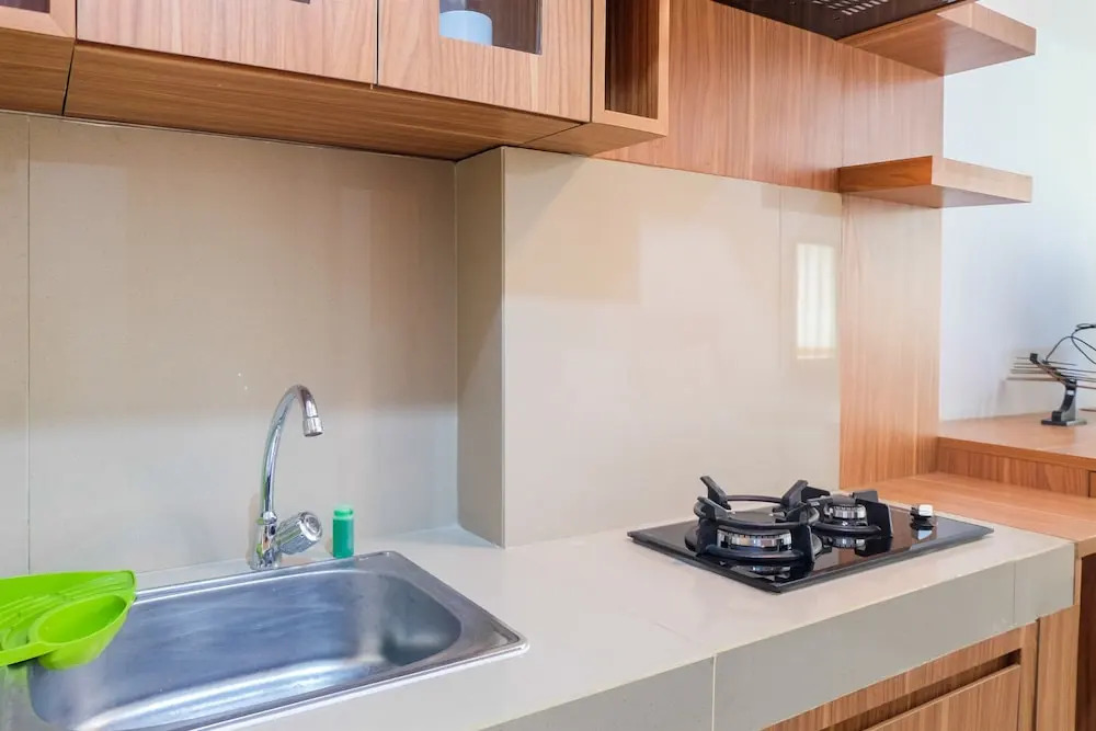 Brand New Compact Studio The Nest Puri Apartment By Travelio