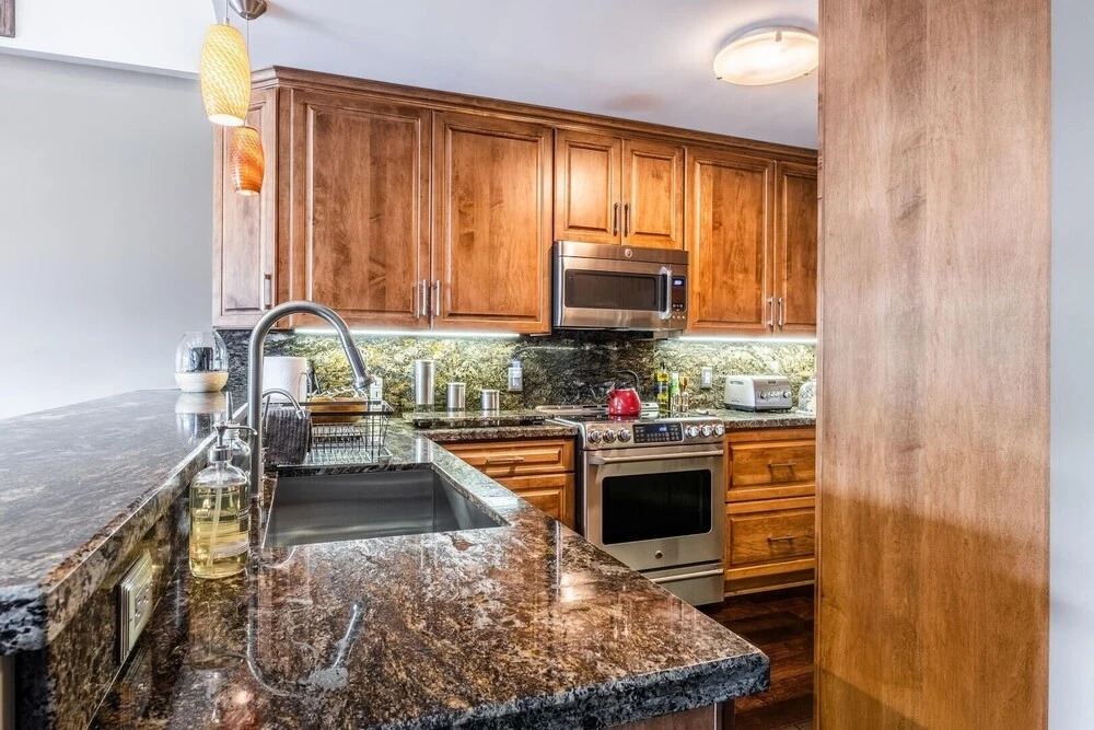 DELUXE SLOPESIDE Condo with 4th FLOOR VIEWS, Elevator and Underground Parking at Canyon Lodge (1849 Condos 409) by RedAwning