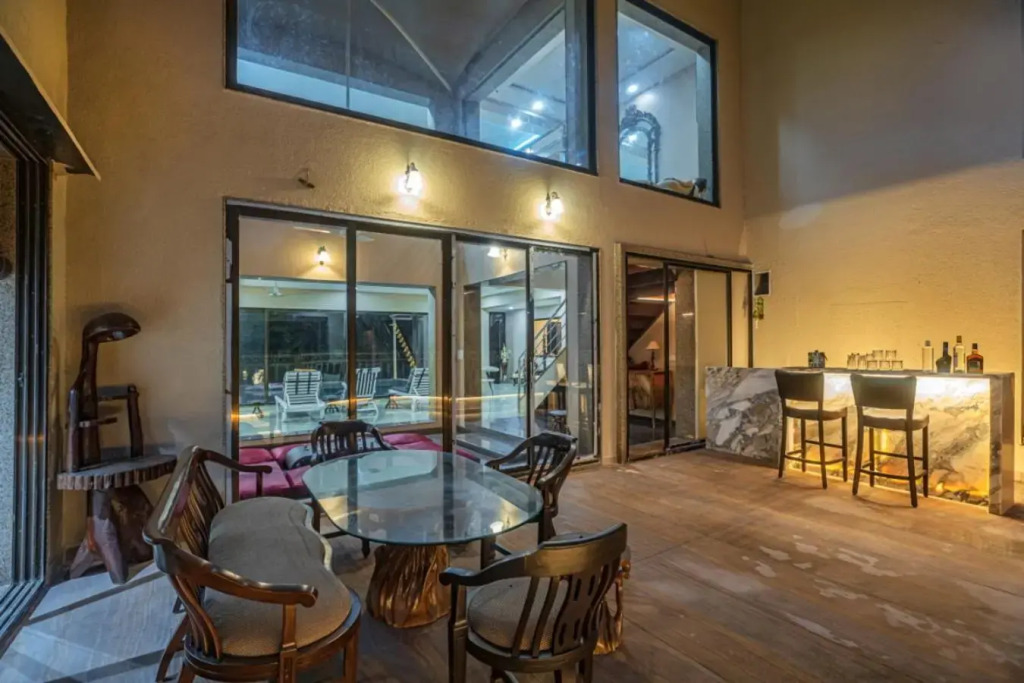 SaffronStays Aura, 4 BR Luxury Pool Villa with Game Room & Lawn