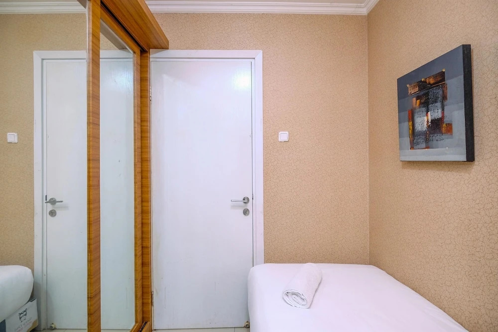 Comfy and Great Choice 2BR Green Pramuka City Apartment By Travelio