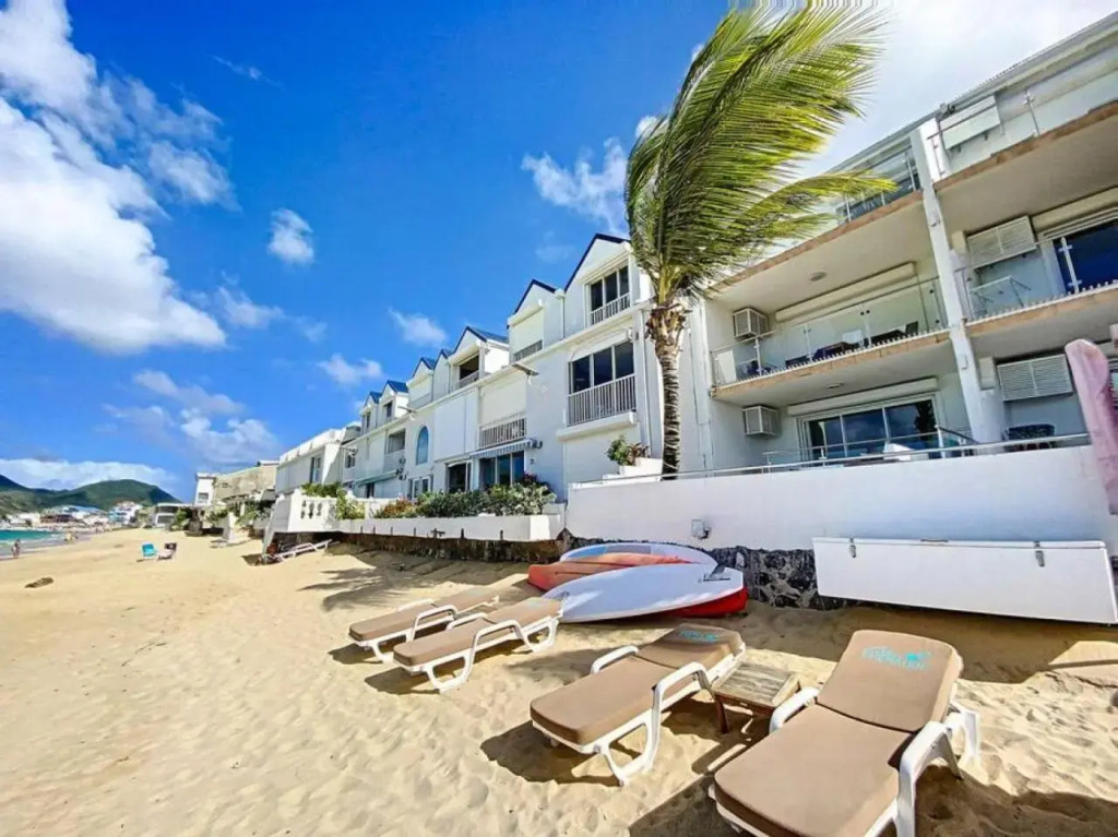 Pavillon Beach 9, feet in the water in Grand Case