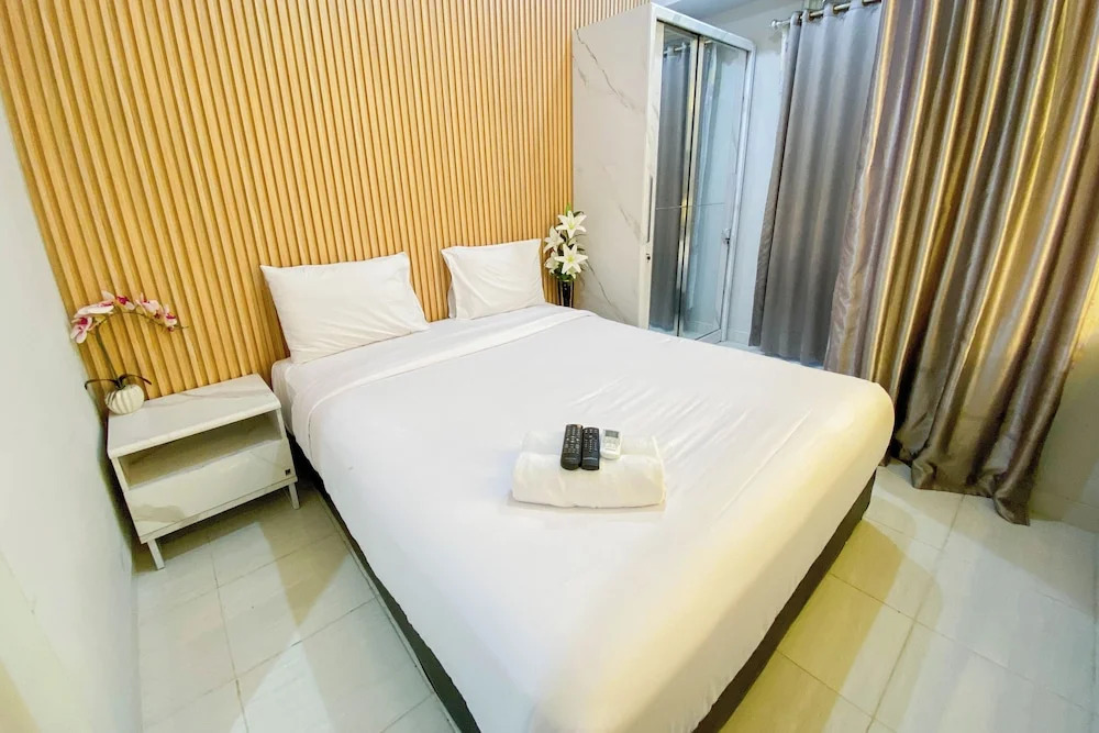 Nice and Cozy Studio at Amartha View Apartment By Travelio
