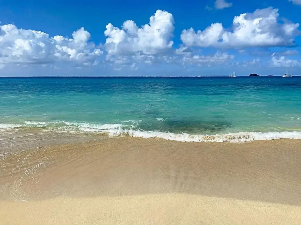 Pavillon Beach 9, feet in the water in Grand Case