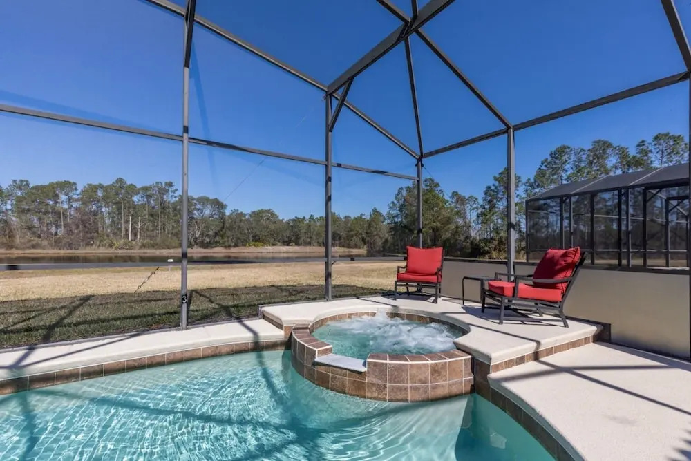 Extended Sunny Pool Deck with Pool and Spa and Lake View in Gated Solterra Resort