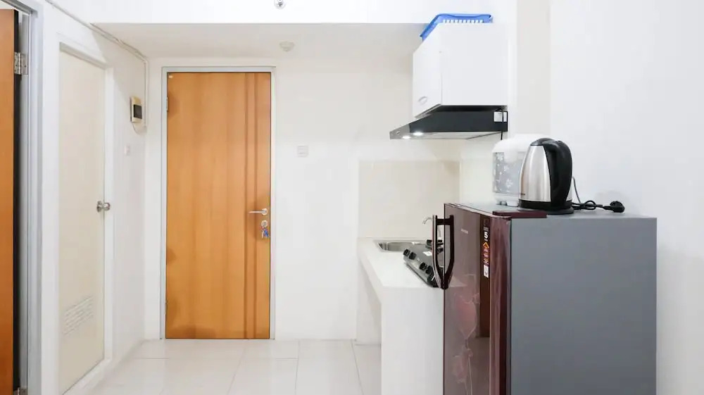 Homey 2BR at Puncak Permai Apartment By Travelio