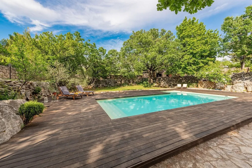 Stone house M&A with pool