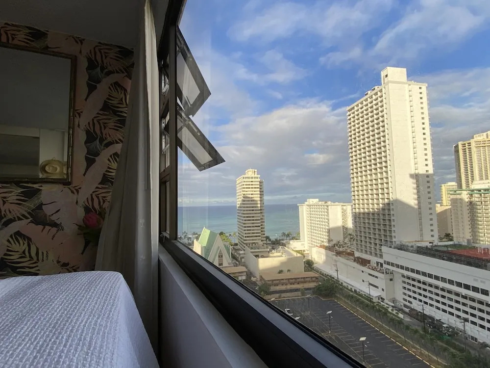 Waikiki Banyan High Level Condo with Ocean Views from the Private Lanai