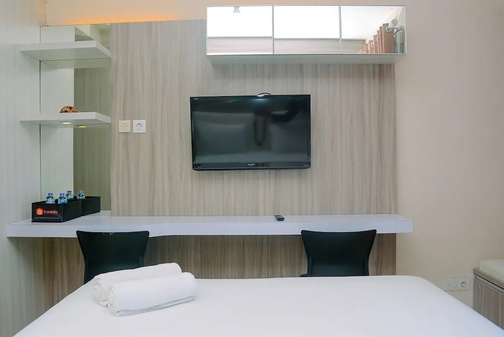 Homey and Cozy Living Studio Room at Tifolia Apartment By Travelio