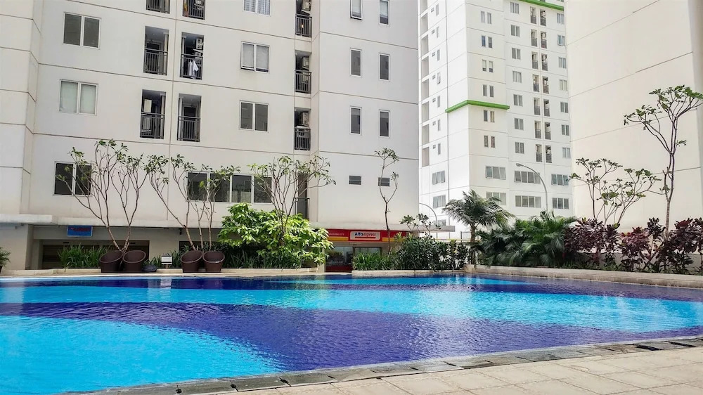 Minimalist 1BR with Pool View at Bassura City Apartment