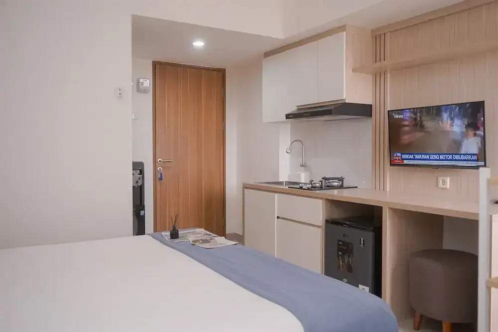 Minimalist And Warm Studio Room At Cisauk Point Apartment