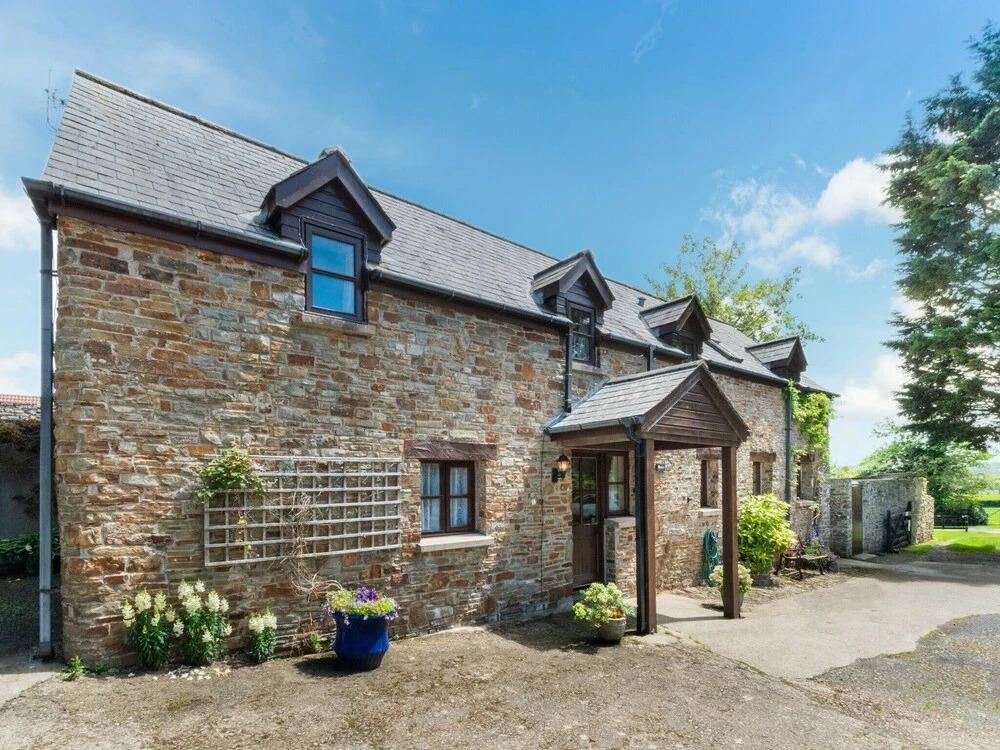 Characteristic Stone Farmhouse in Hilly Devon near Sea