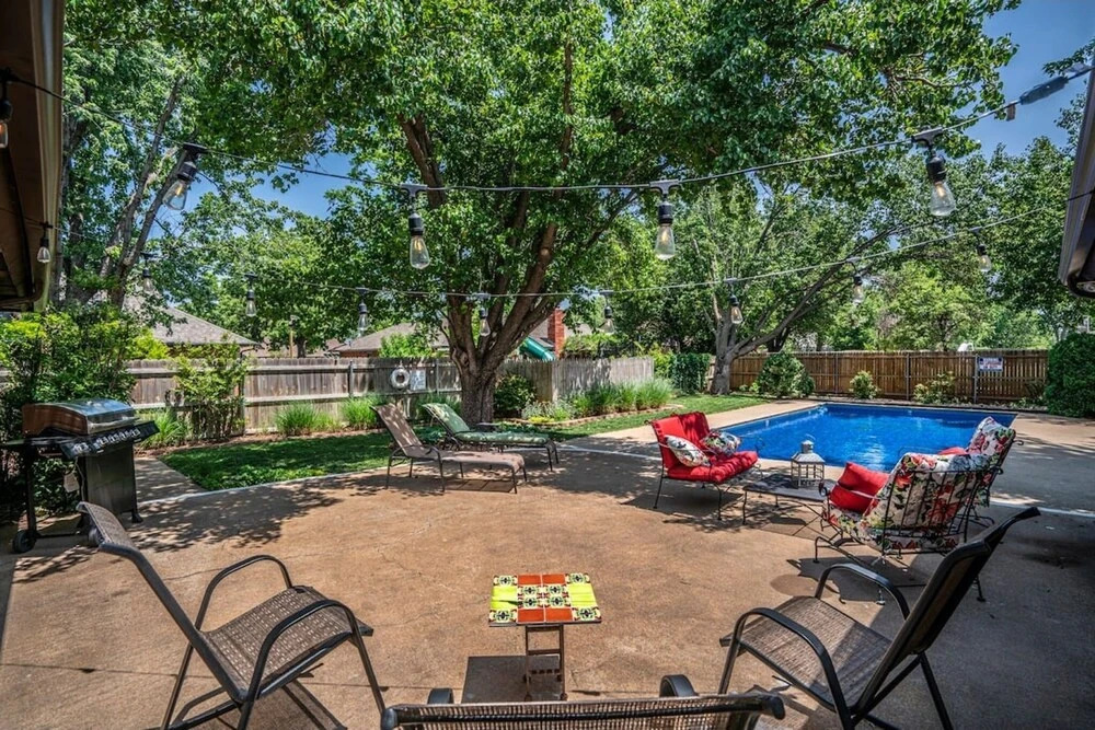 Spacious Retreat With Shaded Yard & Games 4 Bedroom Home by RedAwning