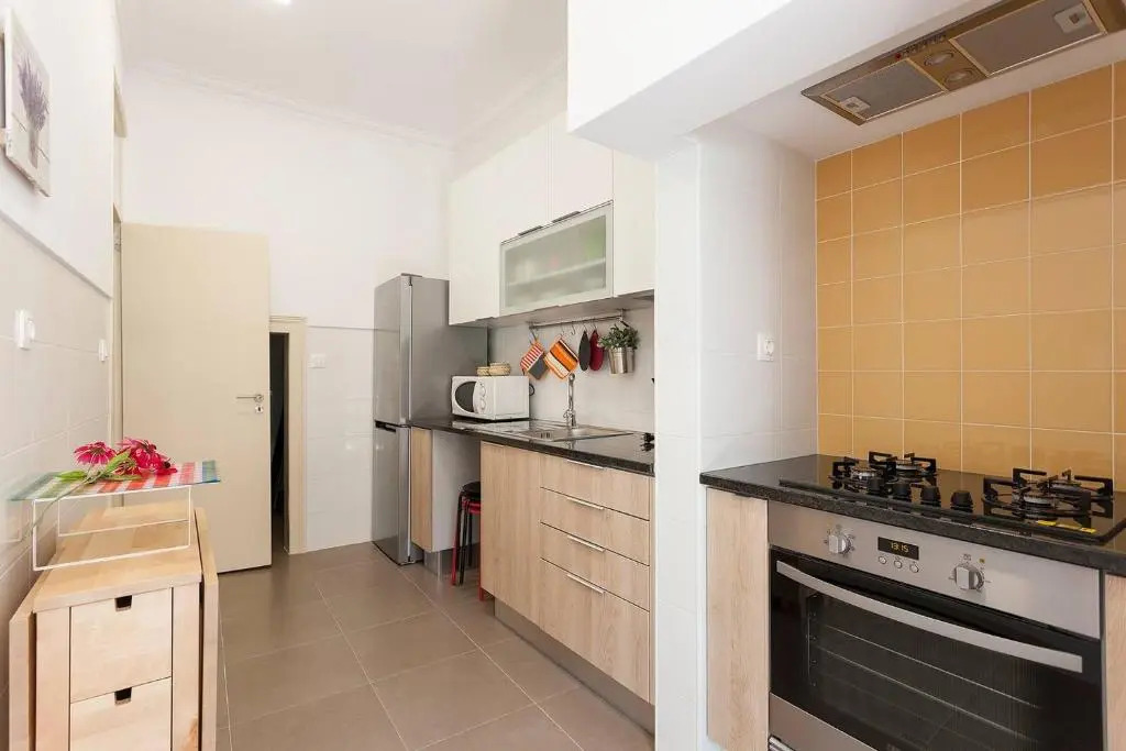 Sunny orange garden apartment in central Lisbon