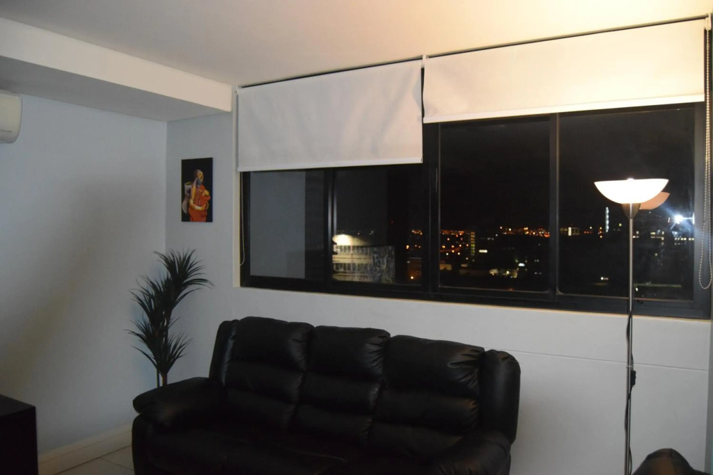 Highrise Windhoek apartment with skyline view, pool and gym