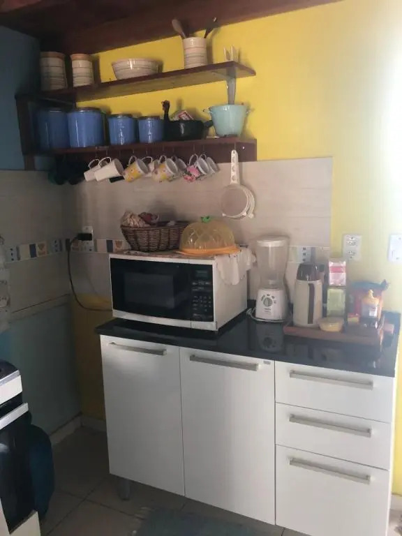 Casa com piscina e um quarto com ar split pé na areia a 50 metros da praia