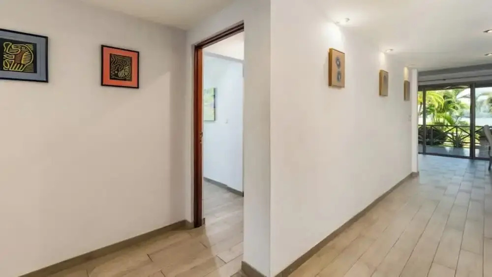 Elegant Condo with Brand-New Fixtures, Shaded Tropical Terrace, and Secluded Beach Access