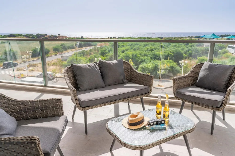 Sunlit Balcony & Coastal Charm by Sea N' Rent