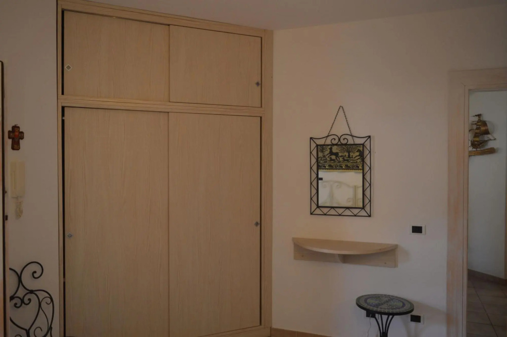 Apartment surrounded by greenery 5 minutes on foot from the beaches of Baia Caddinas and the large s-S'Abba e sa Pedra
