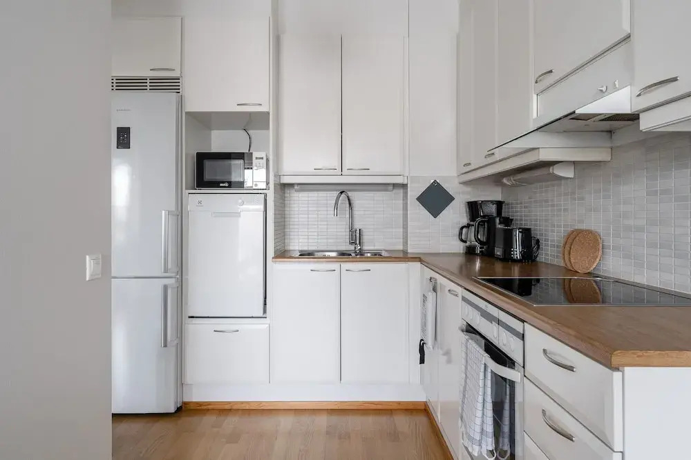 Top Floor 1BR Home with Parking, Sauna and Balcony