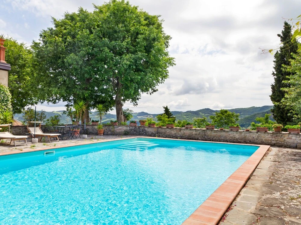 House on the Property Next to an Ancient Villa With a View of the Hills and Pool