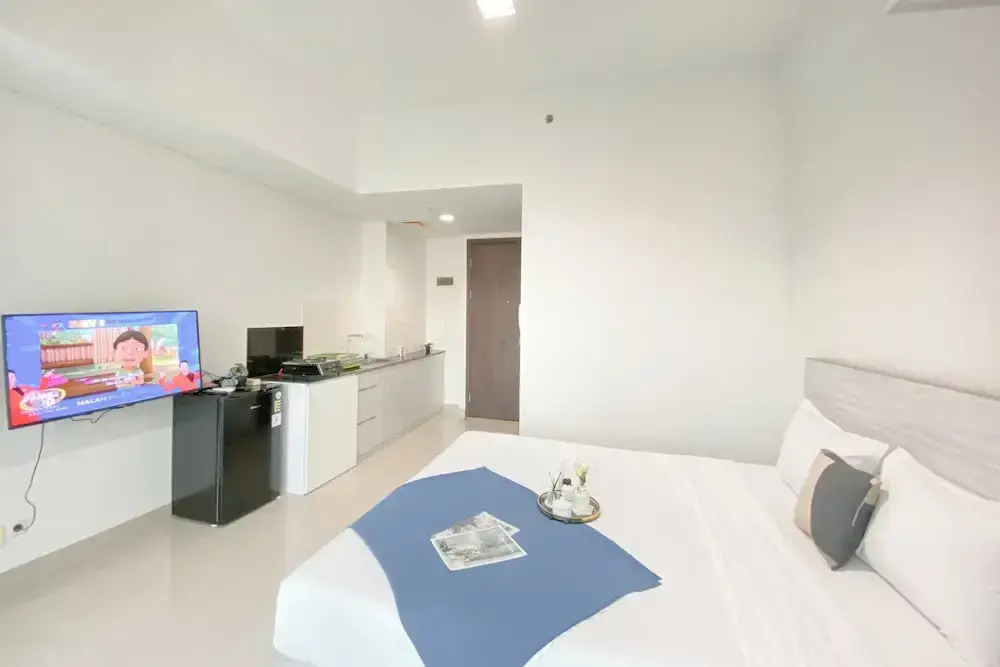 Simple White Designed Studio At Lrt City Bekasi Apartment