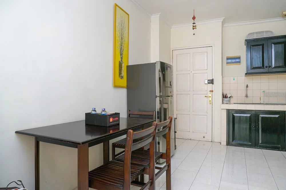 Clean and Homey 1BR at Puri Garden Apartment