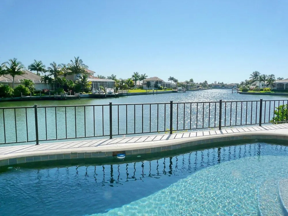 Waterfront home on key lot with pool, spa and views
