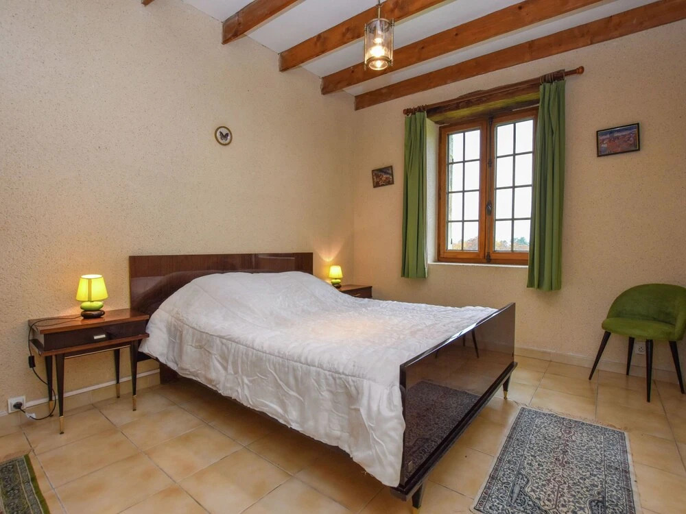 Lovely holiday home in Biron with fenced swimming pool