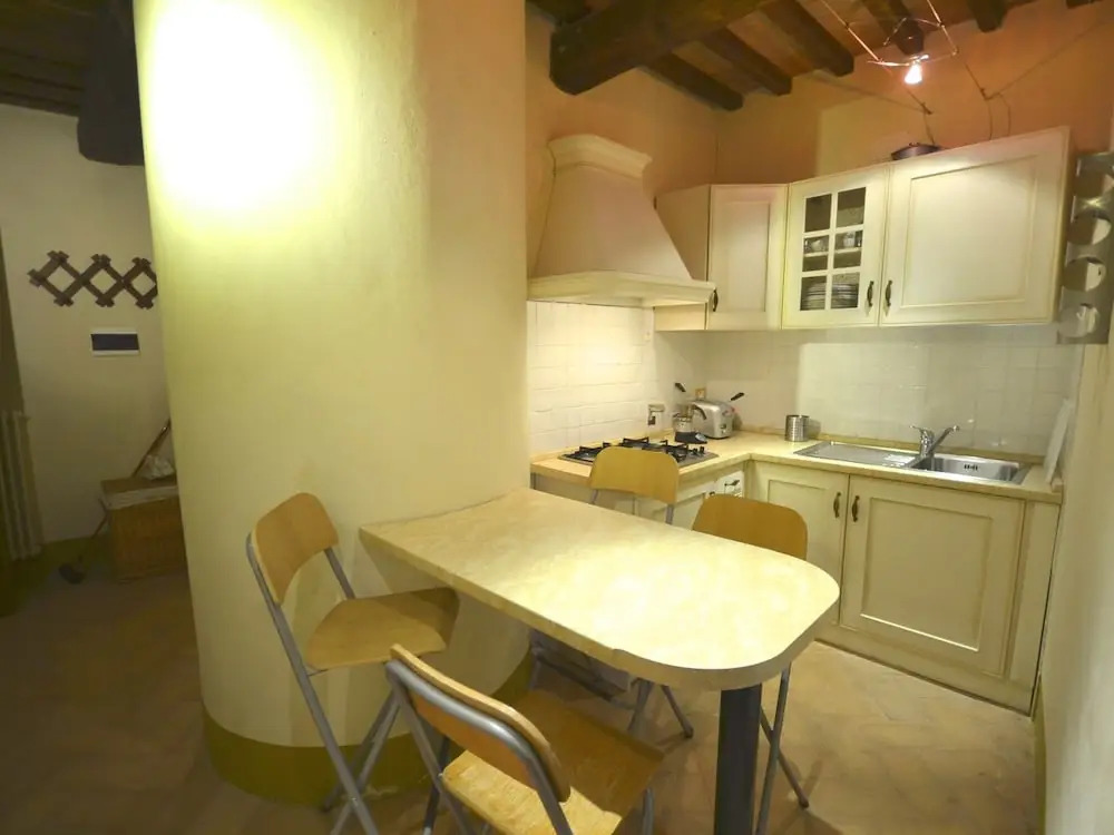 In a wonderful medieval village on the Tuscan hills, with air conditioning