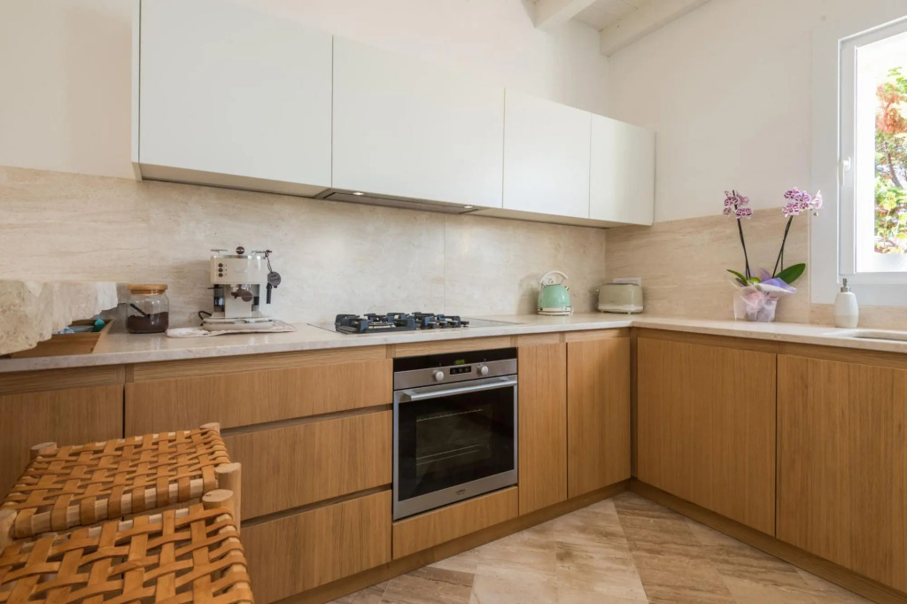 It features a large living area with fully equipped open kitchen and access to the covered terrace d-S'ABBA 1