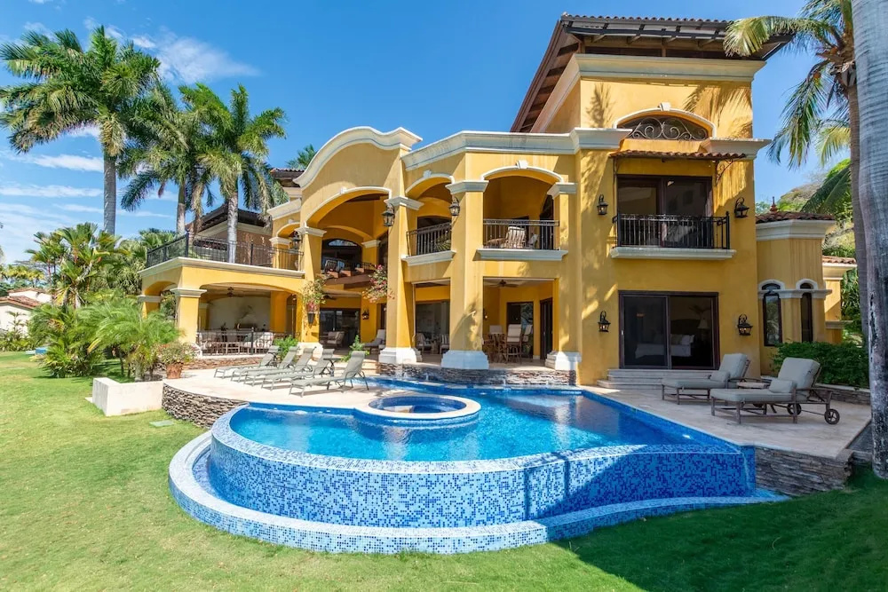 Elegant Mediterranean-Style Mansion with Beachfront Views and Private Infinity Pool