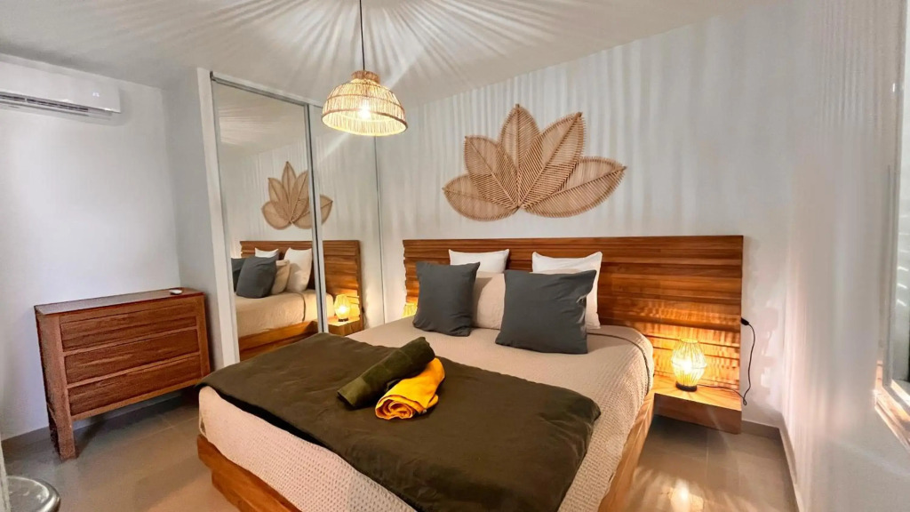 Le Baileys - Spacieux appartement en rez-de-jardin vue lagon