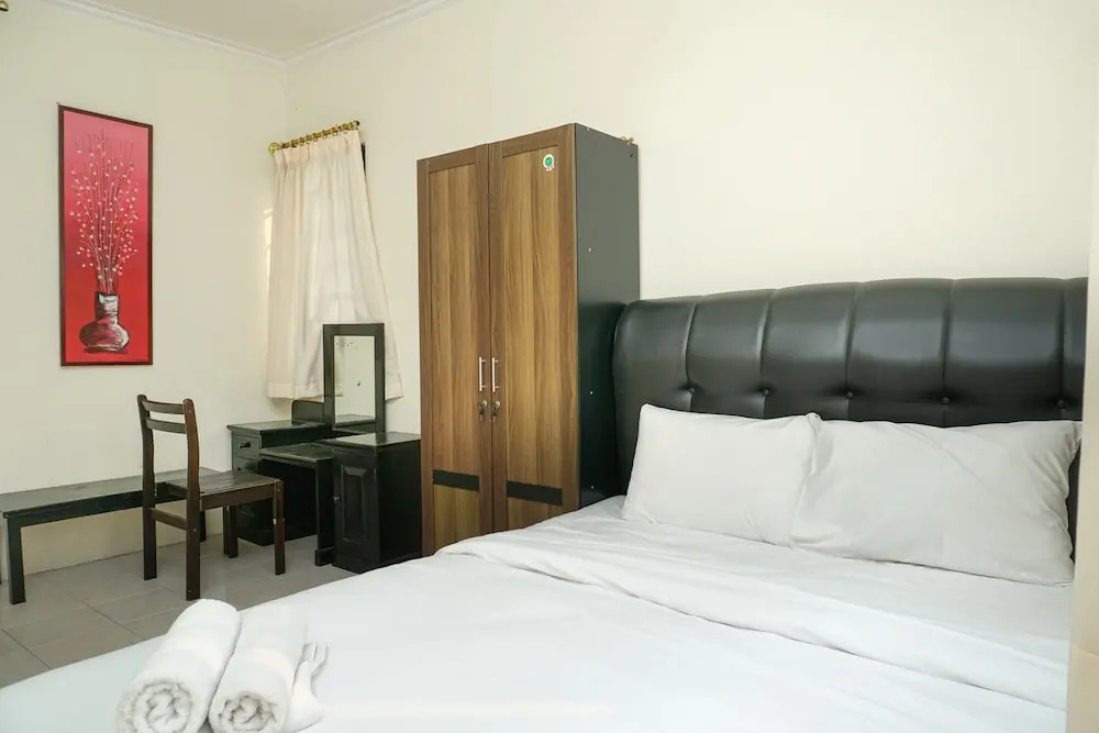 Clean and Homey 1BR at Puri Garden Apartment