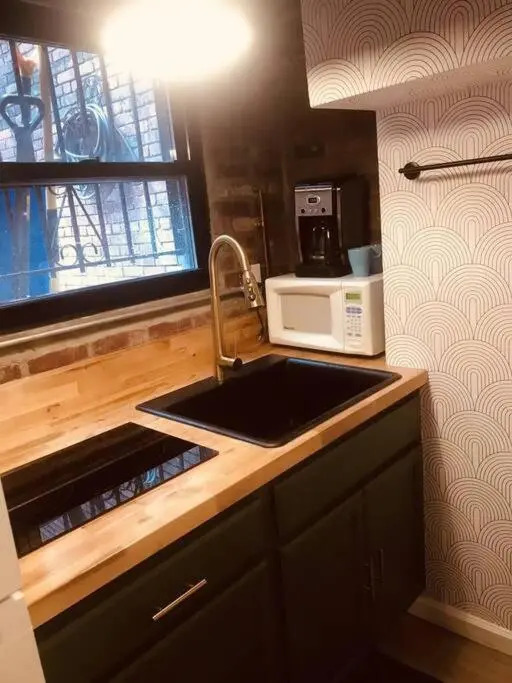 1850s historic Row House 7min train to NYC with private backyard