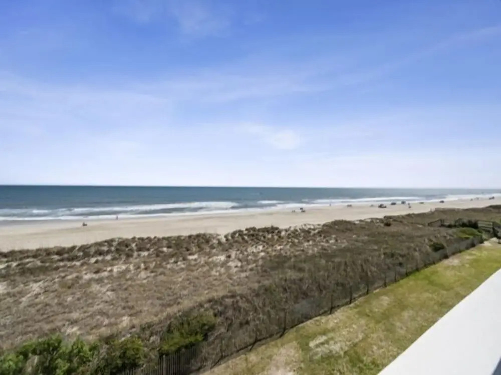 Conched Out - Feel The Ocean Breezes As You Relax On The Deck Overlooking The Lovely Carolina Beach Coastline 2 Bedroom Condo by RedAwning