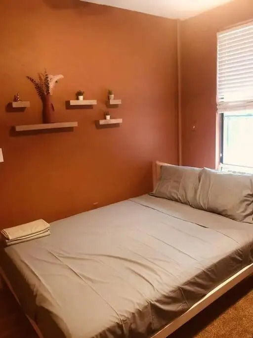 1850s historic Row House 7min train to NYC with private backyard