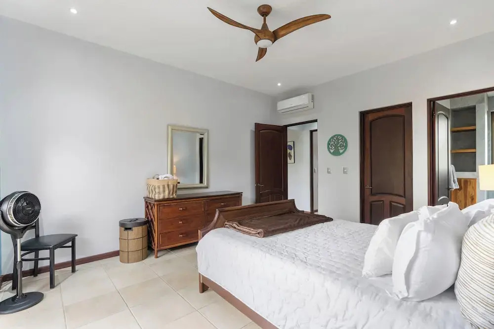 Modern Island-Themed Condo with Floor-to-Ceiling Windows & Garden and Pool Views Within Walking Distance of the Beach