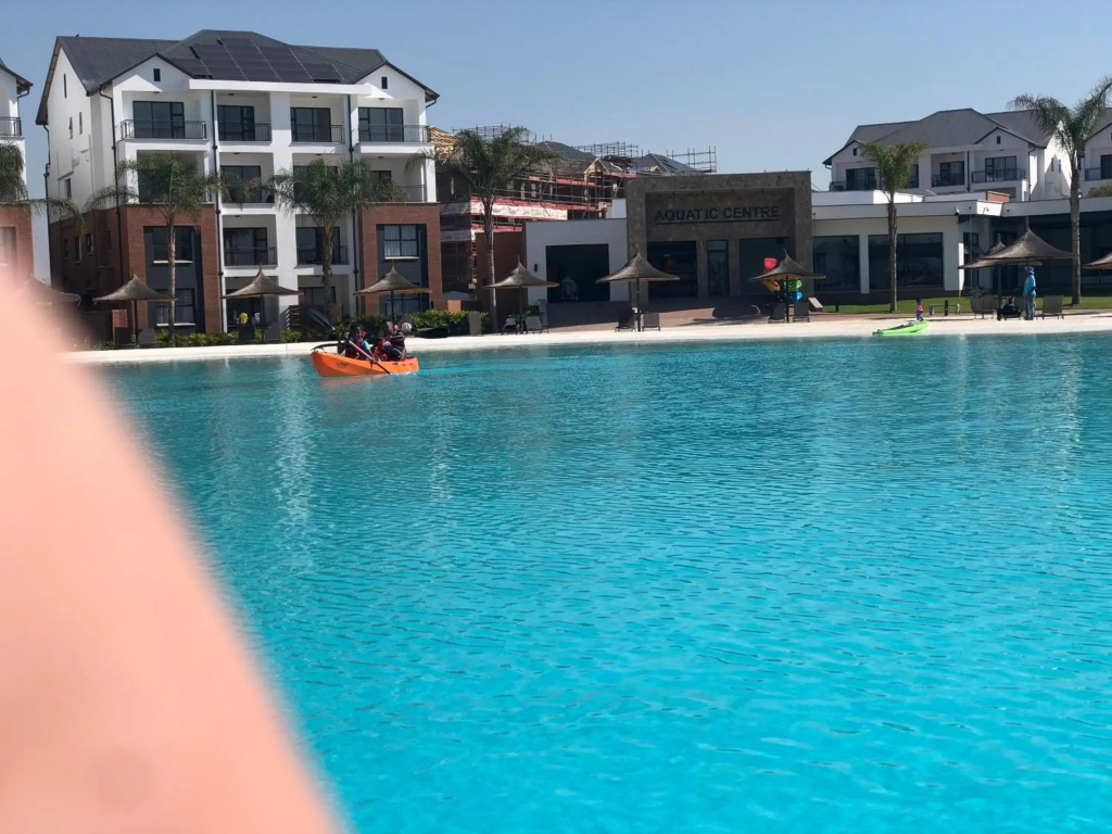 A Coastal/island experience at a Large 2 bed apartment at a Crystal Lagoon Estate