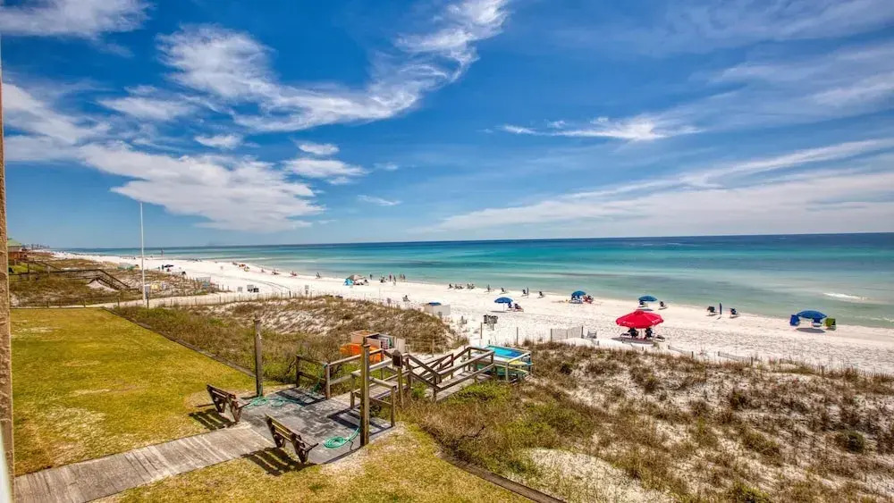 Crystal Villas 6A - Just a few steps and your toes will be in the sand with Beach Service Included