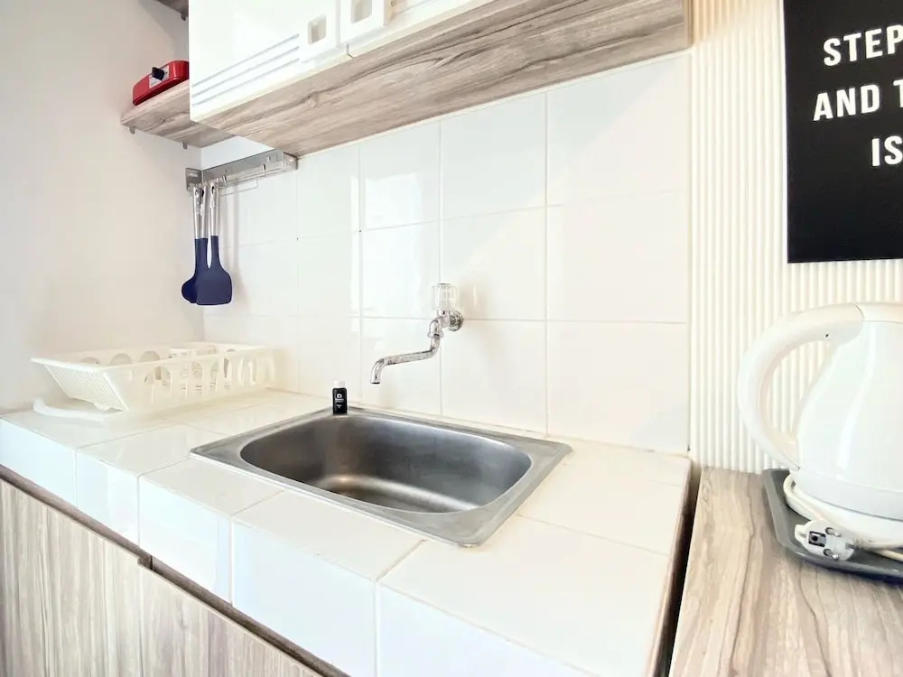 Bright and Private 2BR Apartment at Parahyangan Residence near Nara Park By Travelio