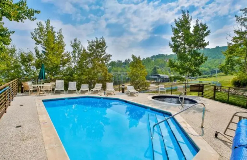 Spacious Ski in, Ski out 3 Bedroom Vacation Rental Next to the Gondola Featuring Slopeside Heated Outdoor Pool and Hot Tub