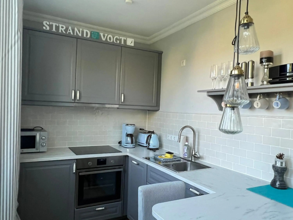 Strandvogt - wunderschöne Ferienwohnung mit Parkettboden und Sonnenbalkon