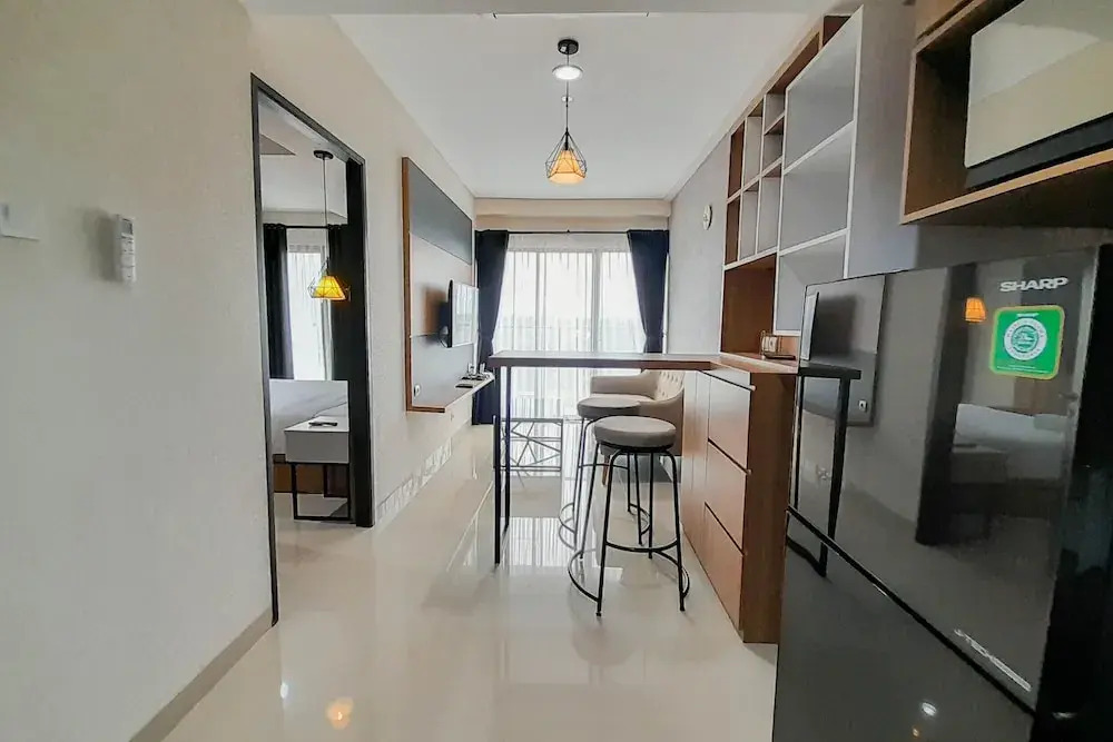 Elegant and Spacious 1BR at Patraland Amarta Apartment By Travelio