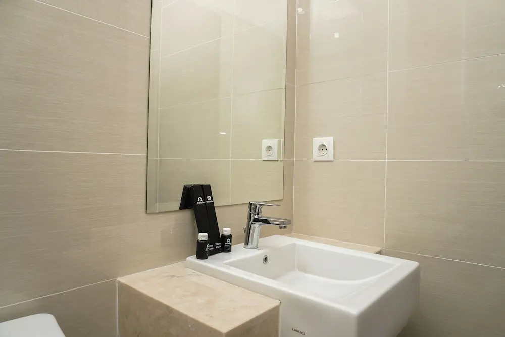 Minimalist Studio Room at Puri Mansion Apartment