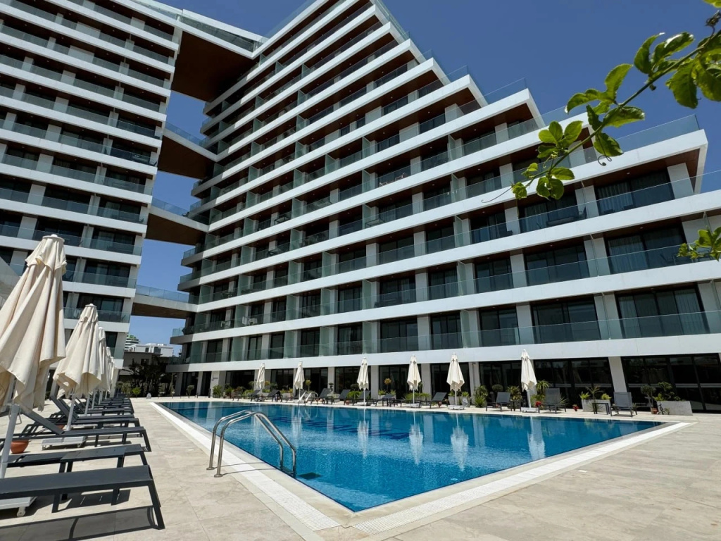 Апартаменты Stylish 1BR Sea View in Longbeach Iskele