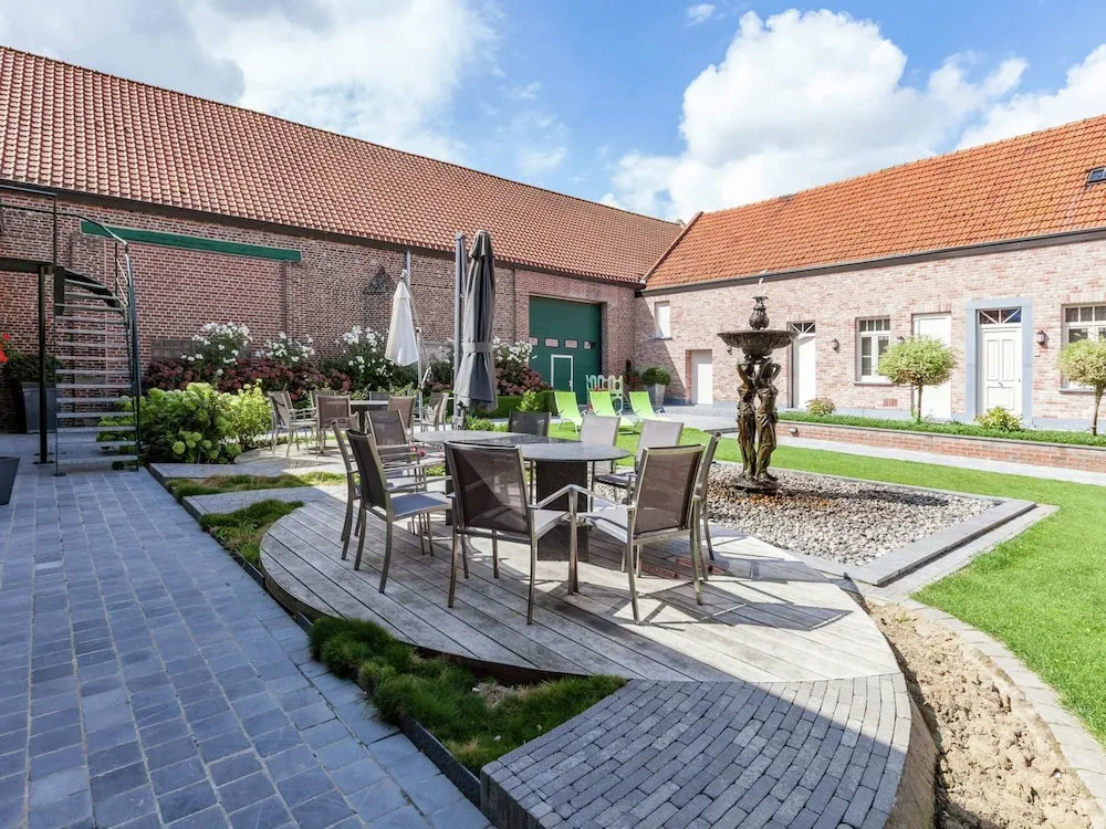 Large cottage overlooking the sunny courtyard with fountain