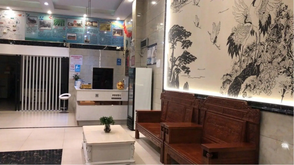Q+ Nanxiong Xinhewan Business Hotel